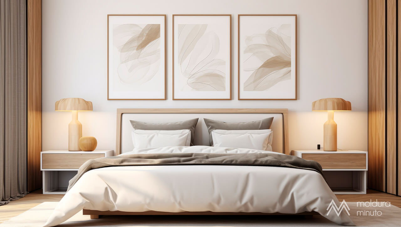 Quarto aconchegante com três quadros minimalistas acima da cabeceira da cama..jpg